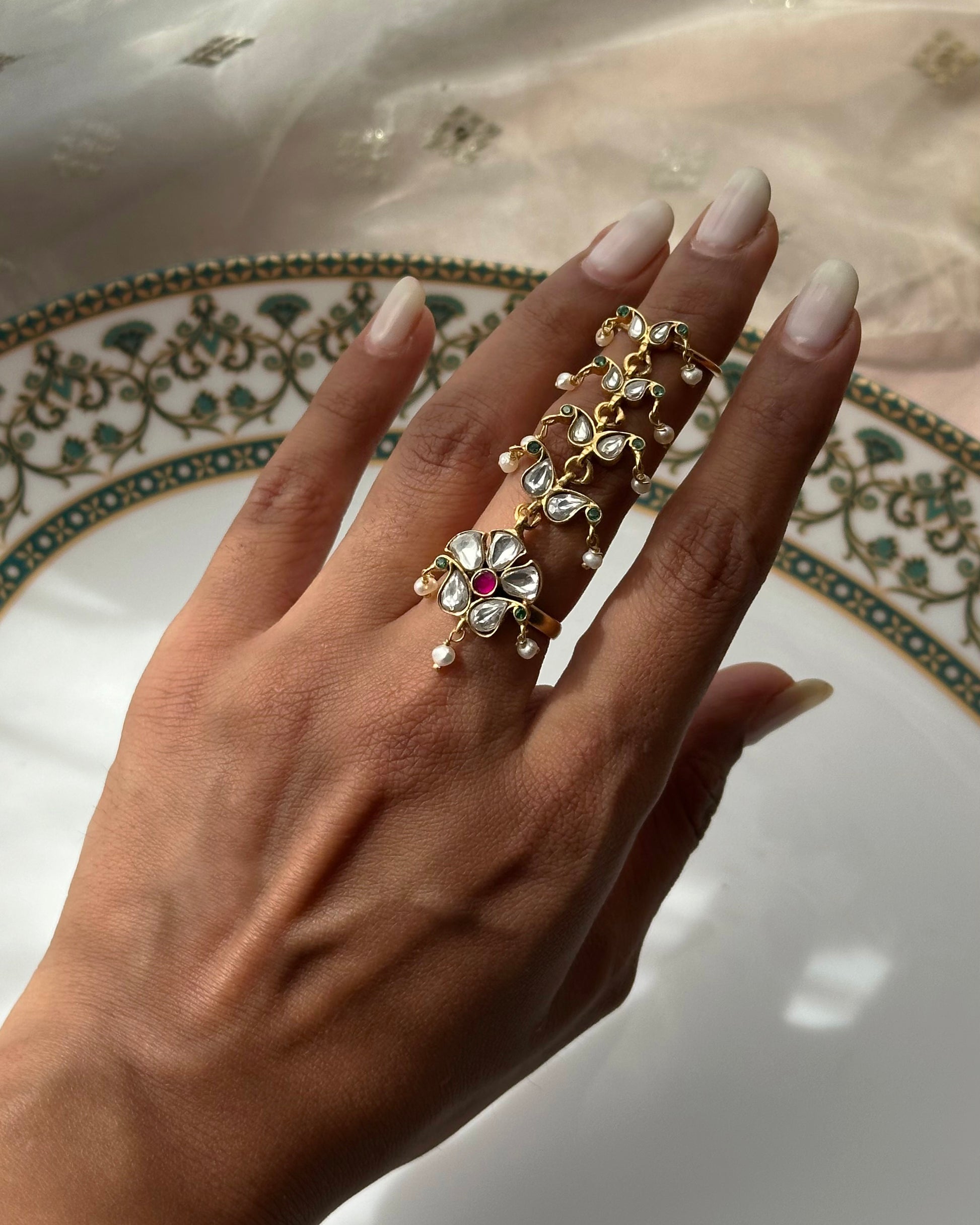 Luxury Nuvi Jewels 925 ring in sterling silver featuring intricate jadau motifs and dainty hanging pearls