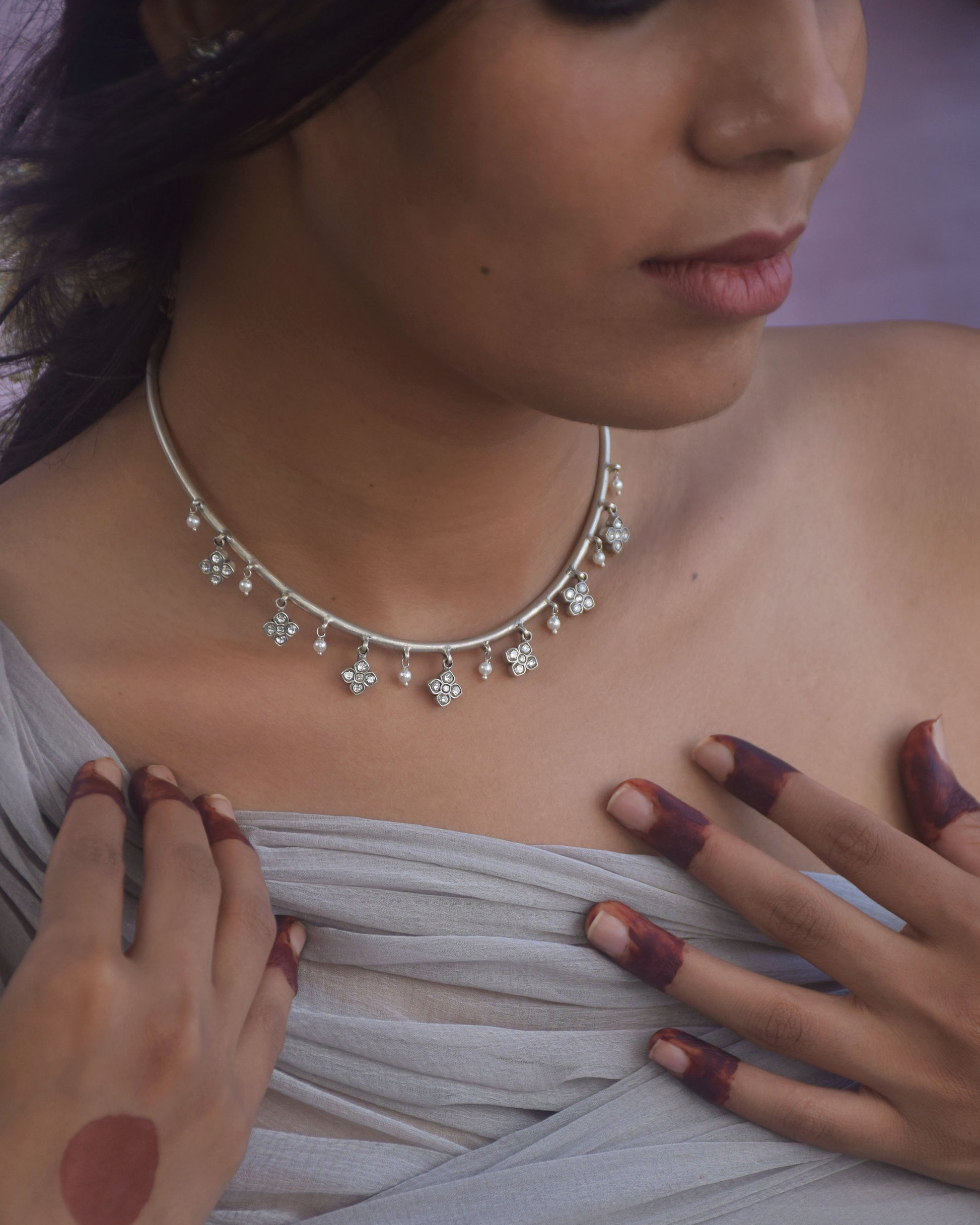 Nuvi Jewels designer Madhura Hasli in 92.5 silver featuring classic floral motifs and pearl drops