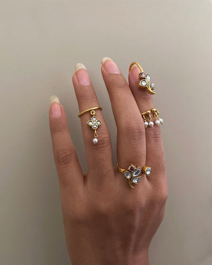 “Nuvi Jewels designer Rasa Mid Ring in 92.5 silver with delicate jadau motif and hanging pearl detail