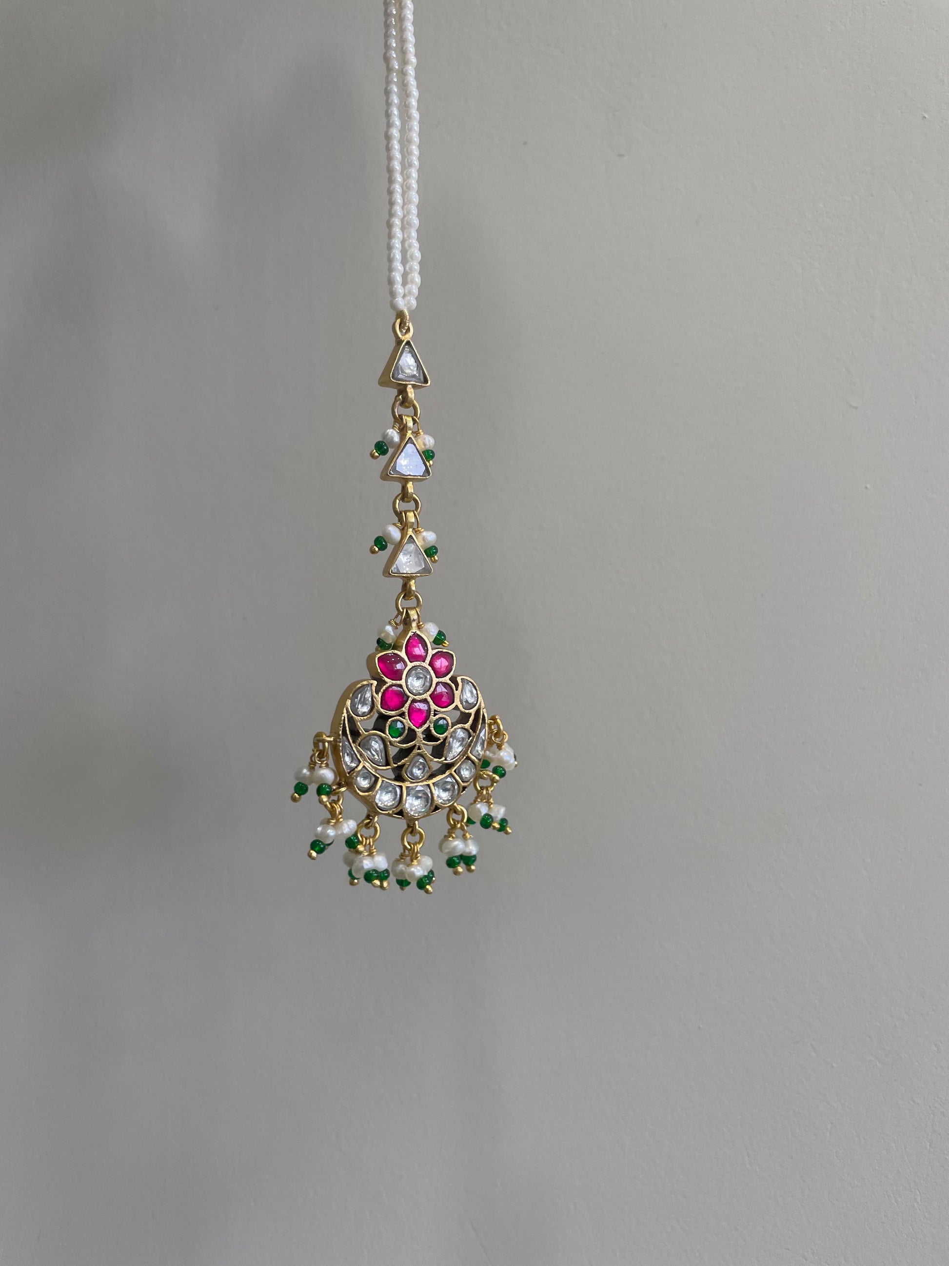 Nuvi Jewels handcrafted mangtikka in 925 sterling silver with gold plating and traditional stone work