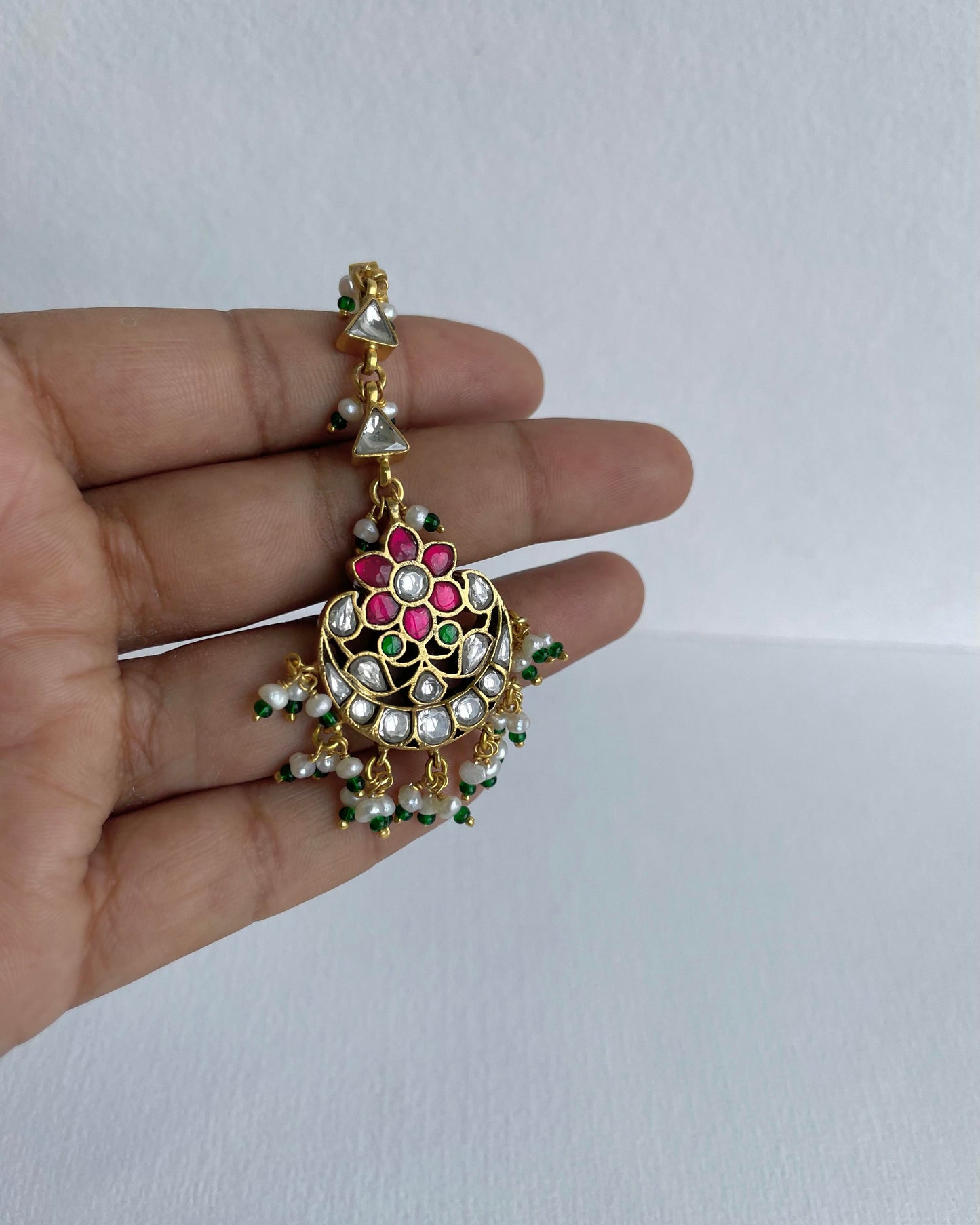 Traditional Nuvi Jewels mangtikka crafted in sterling silver with gold plating and pearl accents