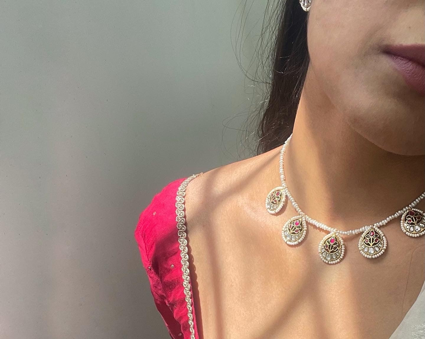 Handcrafted Pankhudi gold-plated silver necklace with delicate pearl accents on each Jadau petal, combining tradition with contemporary elegance.