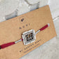 Handmade Kamal rakhi crafted in sterling silver with delicate floral detailing