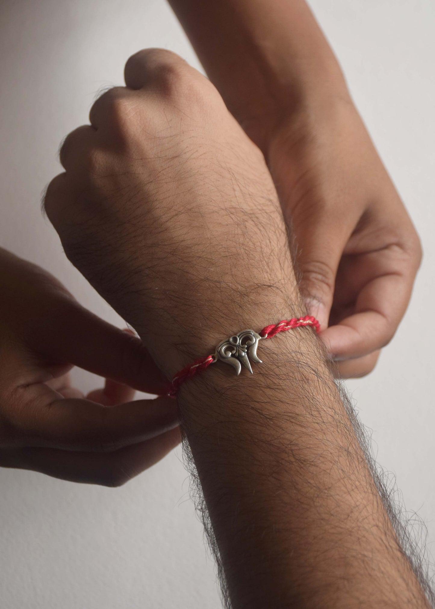 Premium sterling silver rakhi with Trishul centerpiece inspired by sacred symbolism