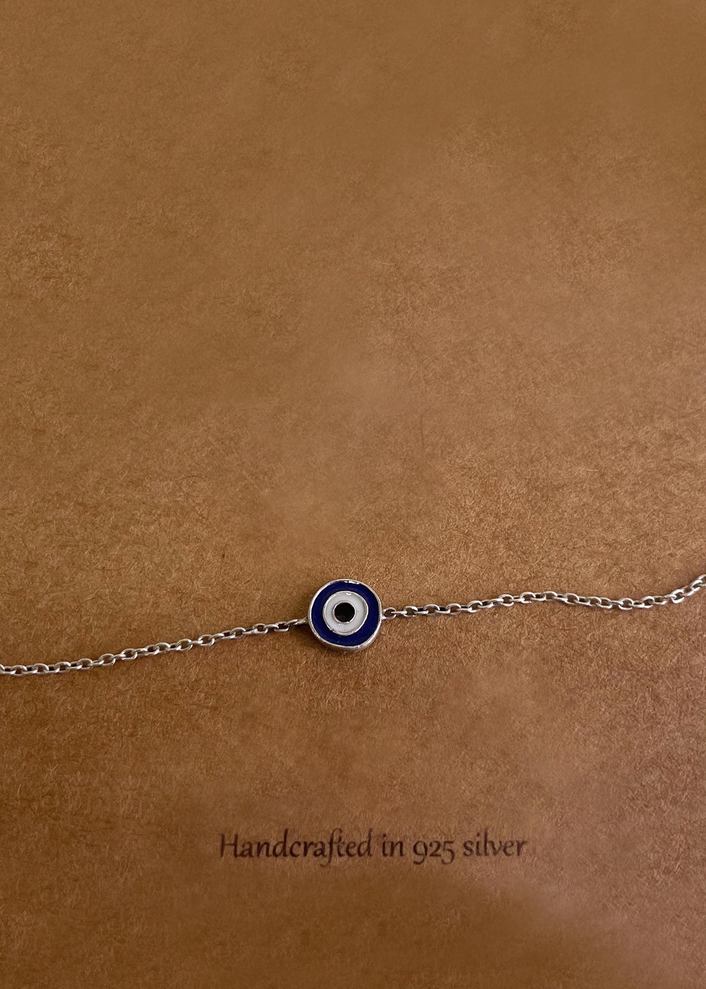 Elevate your jewelry collection with the Enamel Evil Eye 92.5 Silver Bracelet featuring handcrafted artistry and protective symbolism.