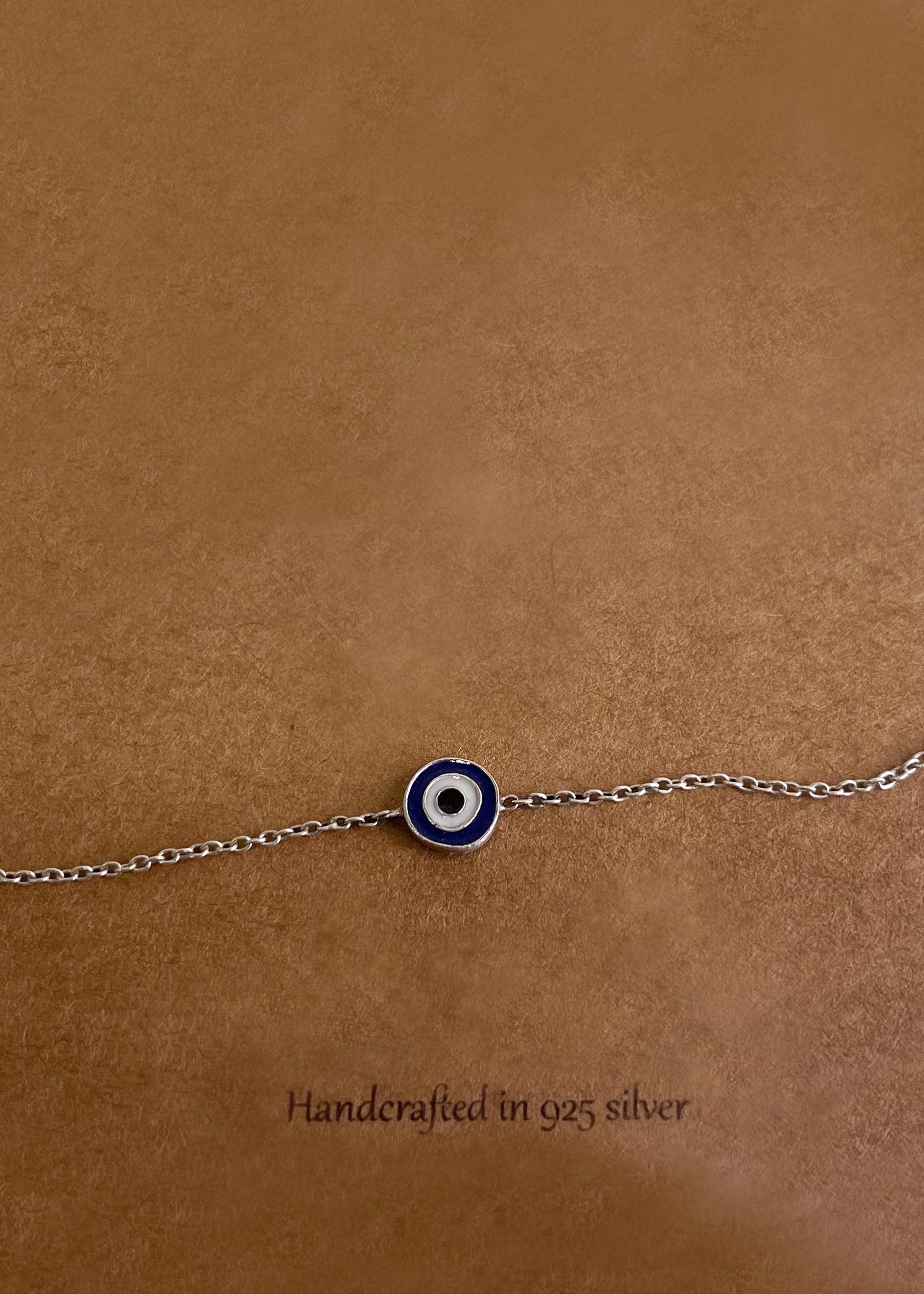 Elevate your jewelry collection with the Enamel Evil Eye 92.5 Silver Bracelet featuring handcrafted artistry and protective symbolism.