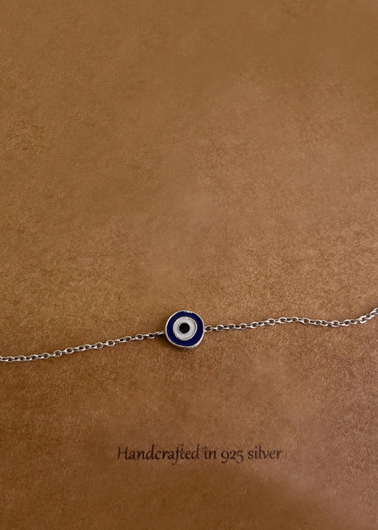 Elevate your jewelry collection with the Enamel Evil Eye 92.5 Silver Bracelet featuring handcrafted artistry and protective symbolism.