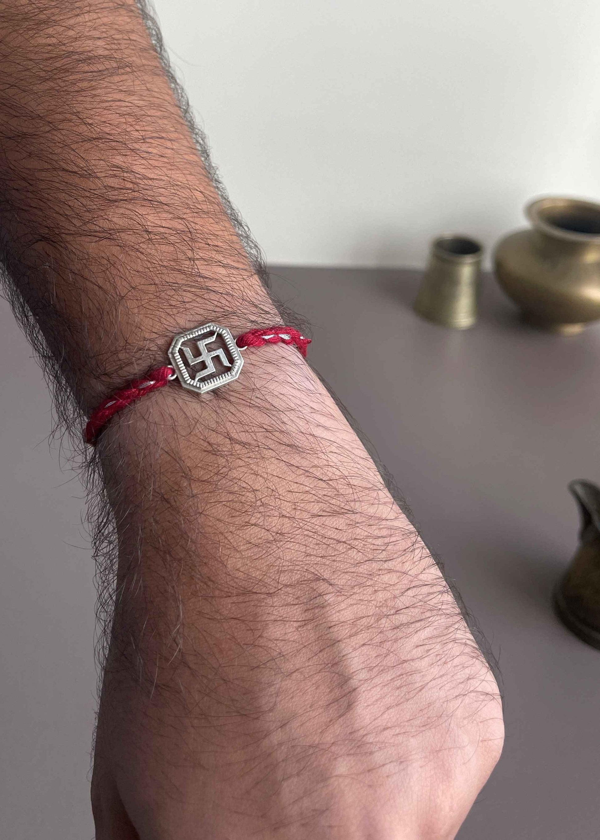 Celebrate Raksha Bandhan with the Swastik 925 Sterling Silver Rakhi designed in sterling silver with sacred and timeless symbolism.