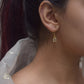 Raatrani Fish Hoop Earrings crafted in 925 silver with 22-carat gold plating, featuring a delicate Jadau stone.