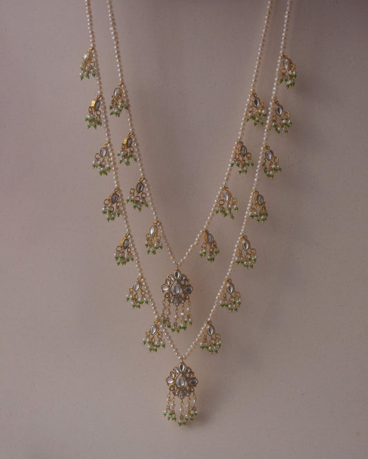 Radharani two-line ranihaar necklace handcrafted in 925 sterling silver, featuring lustrous freshwater pearls and hanging Jadau-studded units.