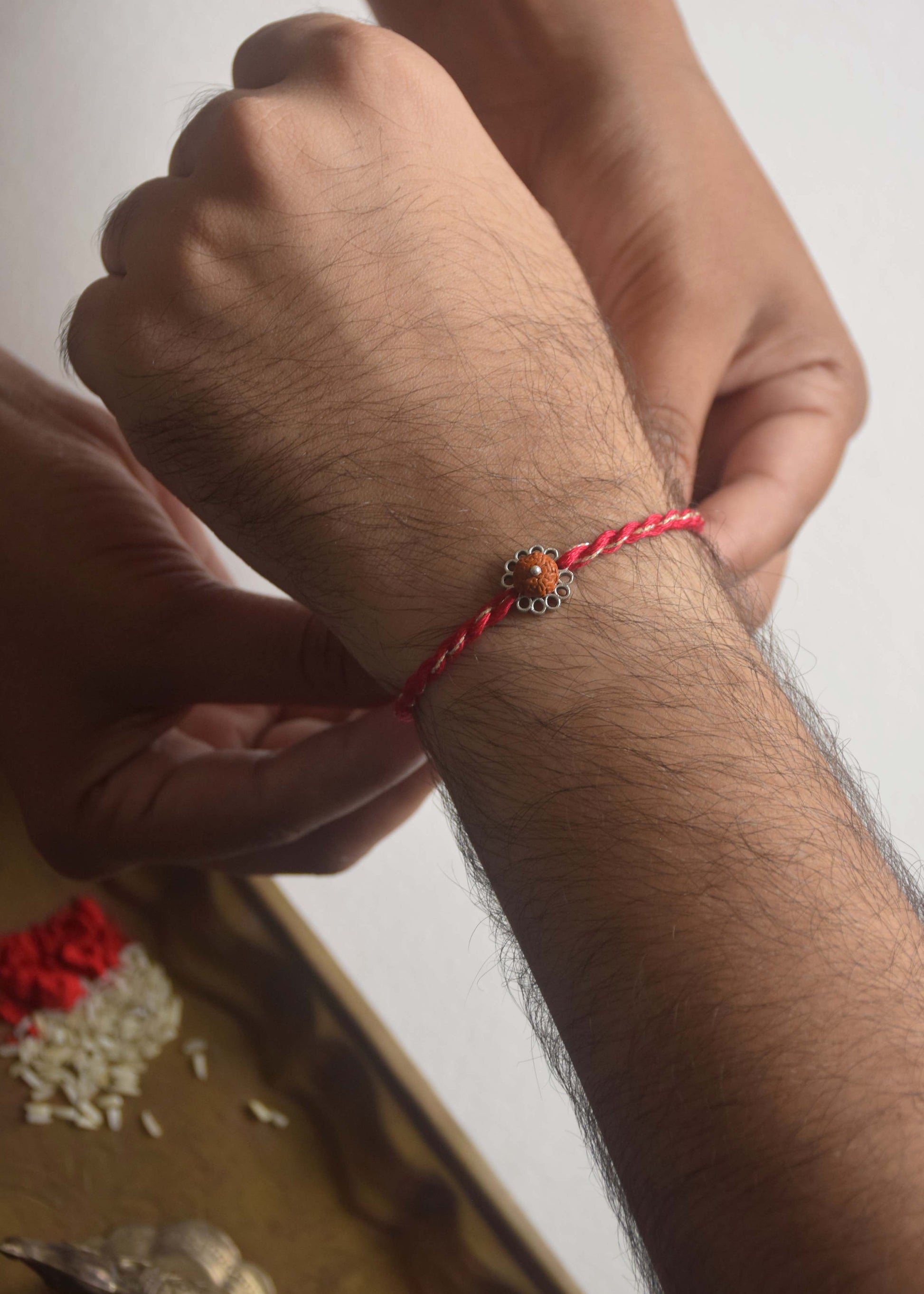 Premium sterling silver rakhi with sacred Rudraksh centerpiece design