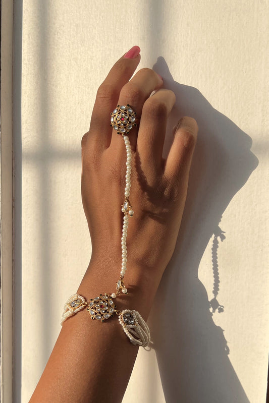 Ranisa Haathphool handcrafted in 925 silver featuring a finger ring connected to an elegant string of pearls.