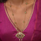 "Rasiya pendant necklace handcrafted in 925 silver, featuring intricate white Jadau polkis, glass-filled stones, and suspended rice pearls.