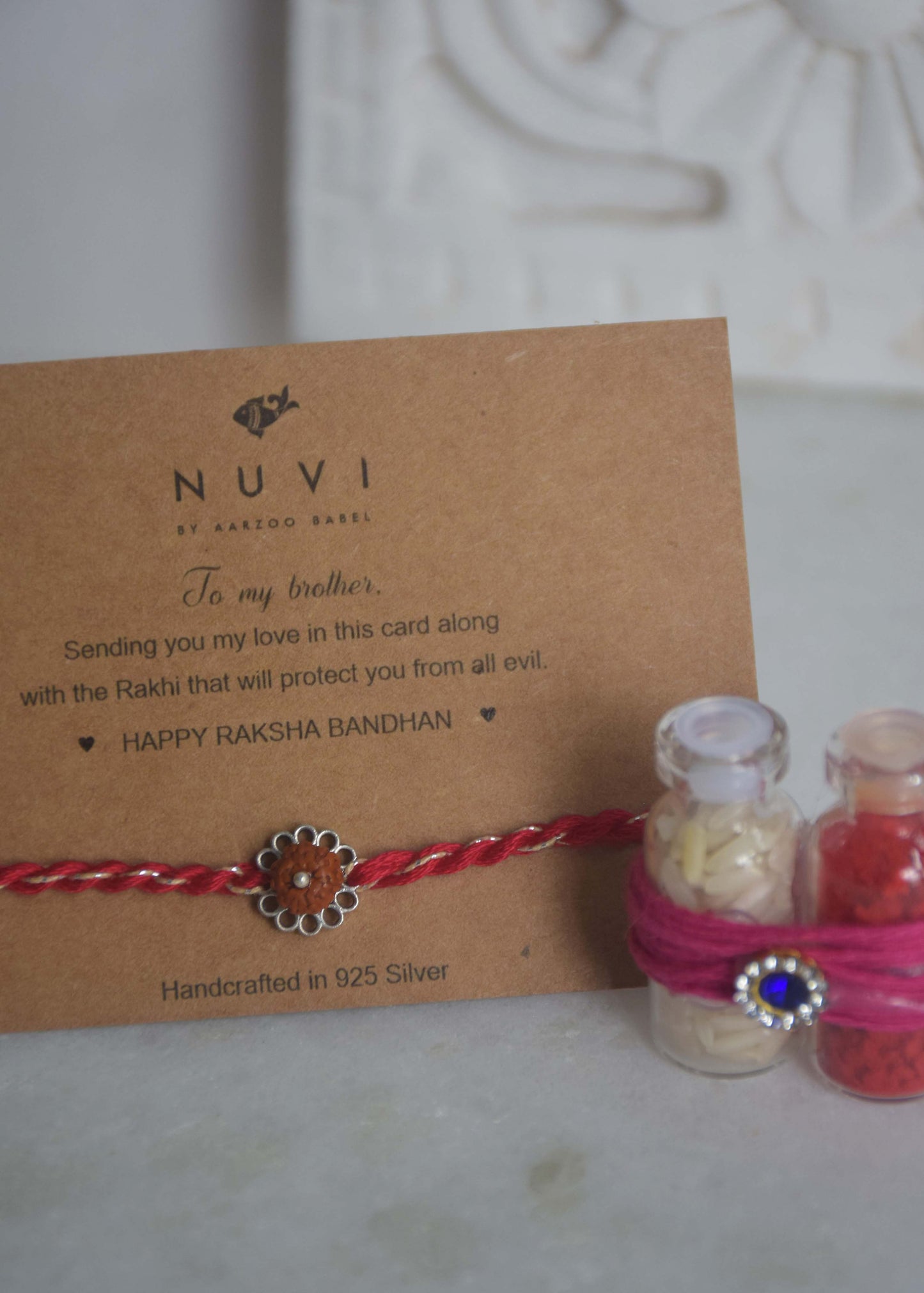 Handcrafted Rudraksh sterling silver rakhi by Nuvi Jewels with spiritual inspired design