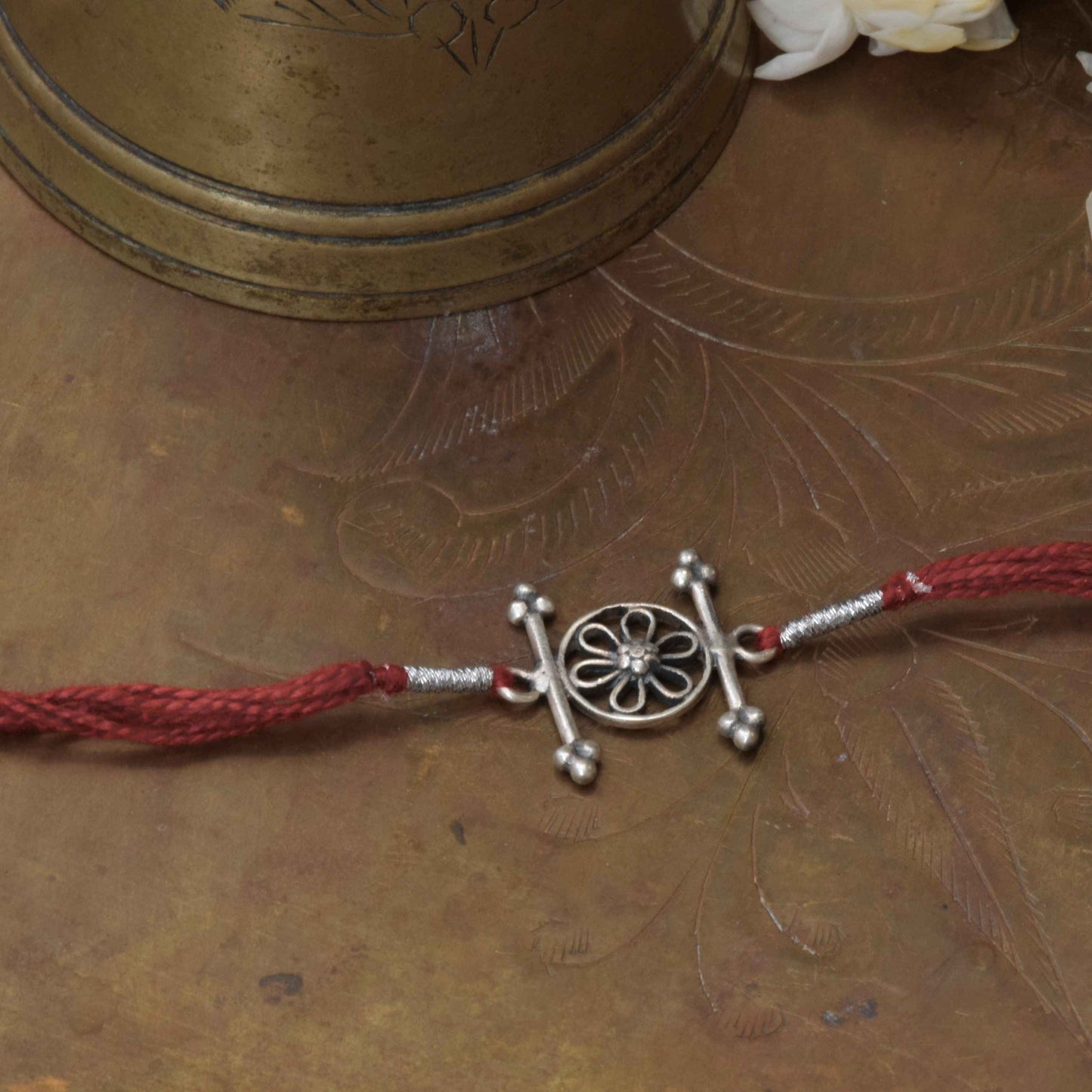  925 sterling silver Rakhi featuring real freshwater pearls and cotton thread,