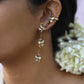 Nuvi Jewels Madhura Earrings in 92.5 silver with four flower motifs, delicate chains, and elegant cuff clip