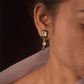 Nuvi Jewels 92.5 silver earrings with striking polki stone, black meena accents, and dangling polki drop
