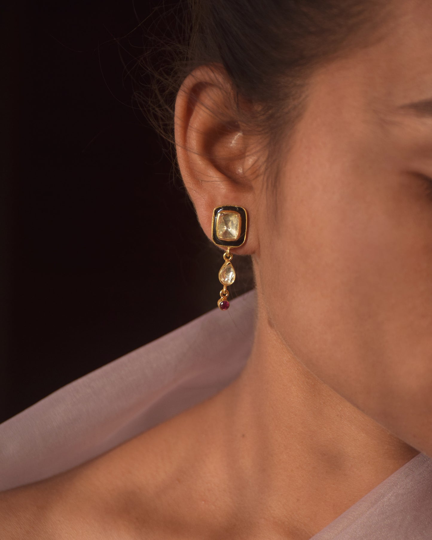 Nuvi Jewels 92.5 silver earrings with striking polki stone, black meena accents, and dangling polki drop