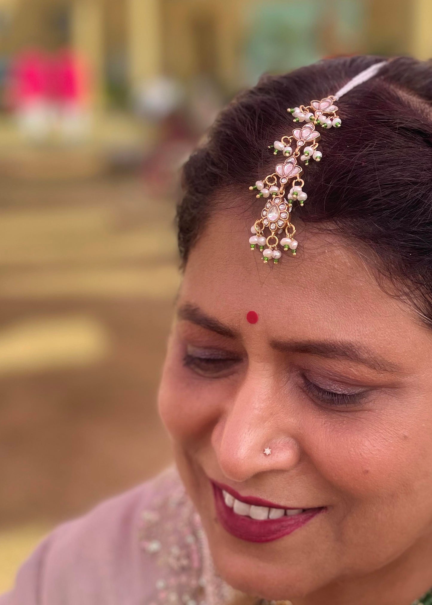 Traditional Indian maangtika in 92.5 silver showcasing intricate jadau craftsmanship and cascading pearl embellishments. Exquisite Handcrafted 925 Silver Jewellery

