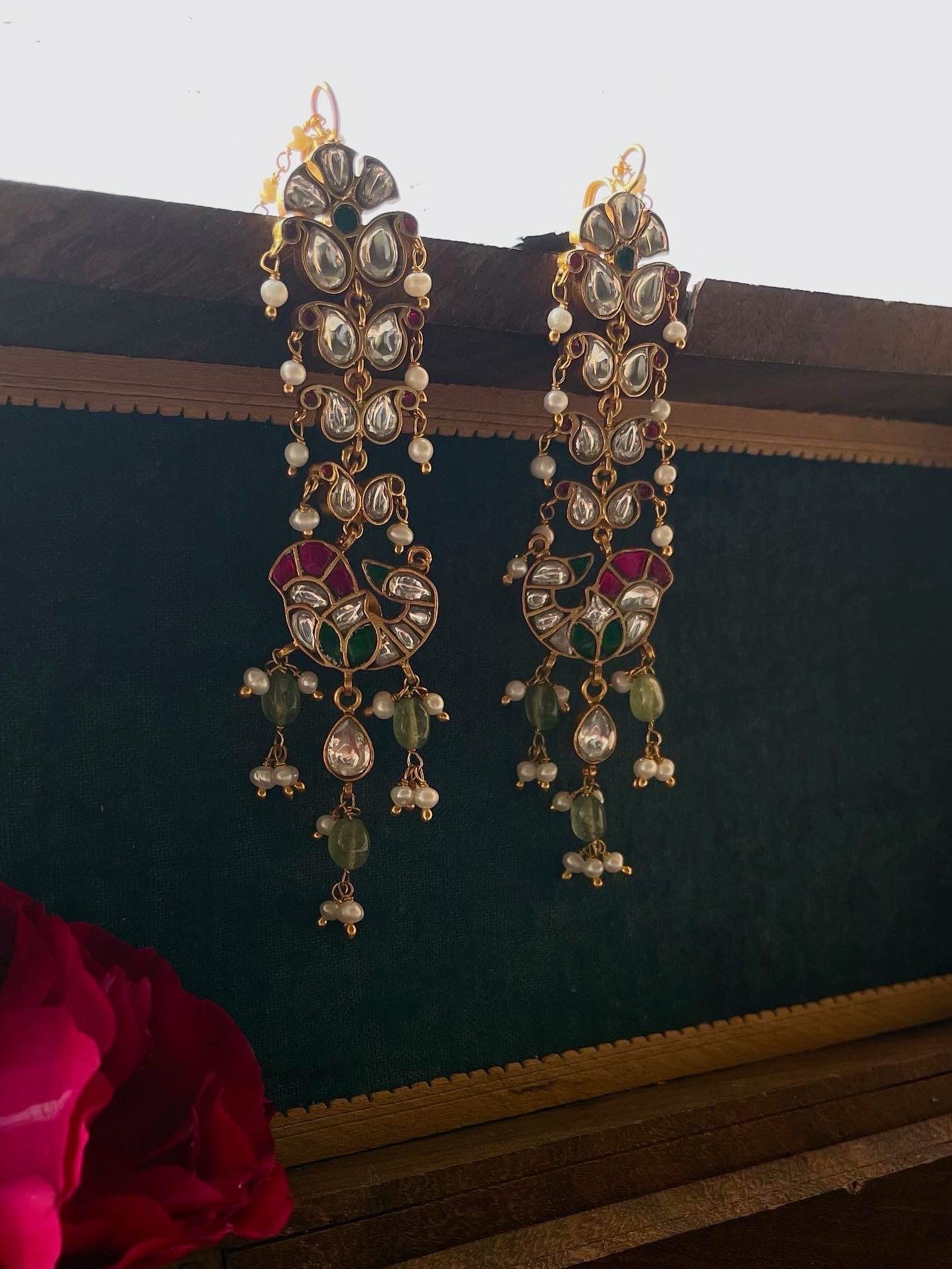 Gold-polished 925 silver earrings with peacock-inspired kaanchain design and extra pearl chain for adjustable fit