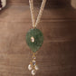 Artisanal Navya long necklace made of hallmarked 925 silver, showcasing a unique hand-carved green quartz stone and delicate polki, on a premium freshwater rice pearl mala.