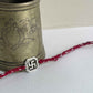 Handmade Swastik rakhi in sterling silver