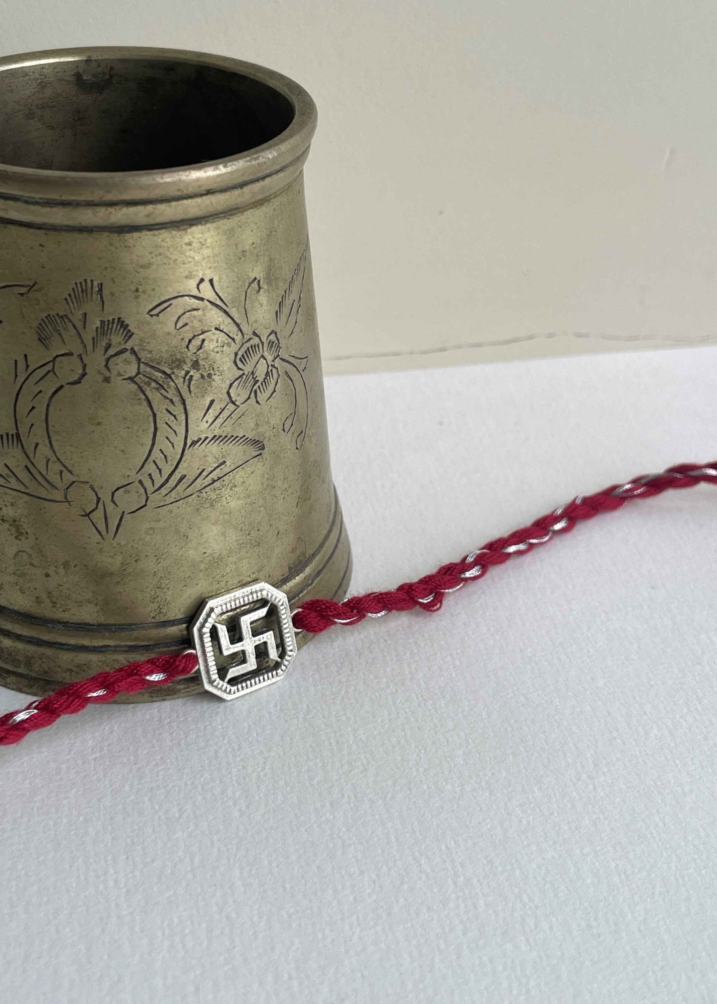 Handmade Swastik rakhi in sterling silver