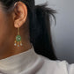 Taranngi Hoop Earrings featuring pear-shaped carved aventurine stones paired with elegant drop-shaped Jadau units.