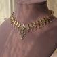 Vanya necklace handcrafted in 92.5 sterling silver, featuring intricate Jadau work and a flowing line of paisley motifs, elegantly finished with dangling pearl drops.