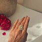 Handcrafted floral silhouette Taarika ring in 925 sterling silver with radiant uncut style polki stones and gold plating.